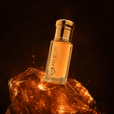 Aurumm 12ml perfume bottle by Majestic Perfumes India, sleek glass container with a metallic cap and elegant design.