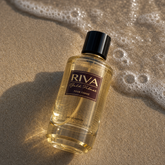 Majestic Perfumes India Riva Gold Velnet 100ml perfume bottle with gold accents and elegant design.