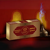 Majestic Perfumes India Bakhoor Honey in a decorative container, showcasing fragrant traditional incense for home use