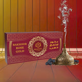 Majestic Perfumes India Bakhoor Rose Gold with ornate container, fragrant incense blocks in a luxurious rose gold design.