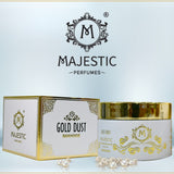 Shimmering gold dust from Majestic Perfumes India in a small glass jar with a gold lid, sparkling under light.
