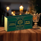 Majestic Perfumes India Bakhoor Flowering incense blocks with floral aroma, displayed in a decorative container.