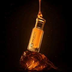 Majestic Perfumes India AURUM 12ML perfume bottle with elegant design and clear glass showcasing the fragrance inside.